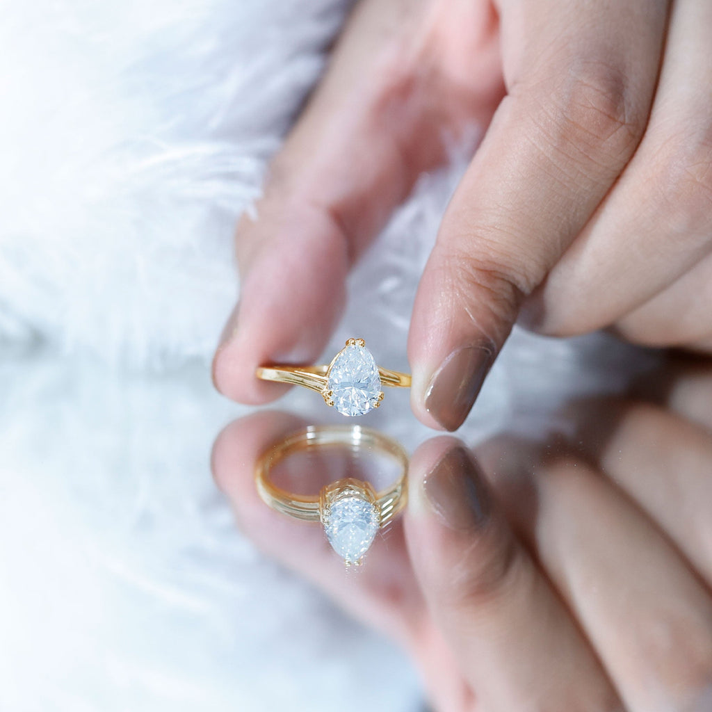 Pear Moissanite Ring – 2 Carat Solitaire Engagement With Bypass Design Elegance