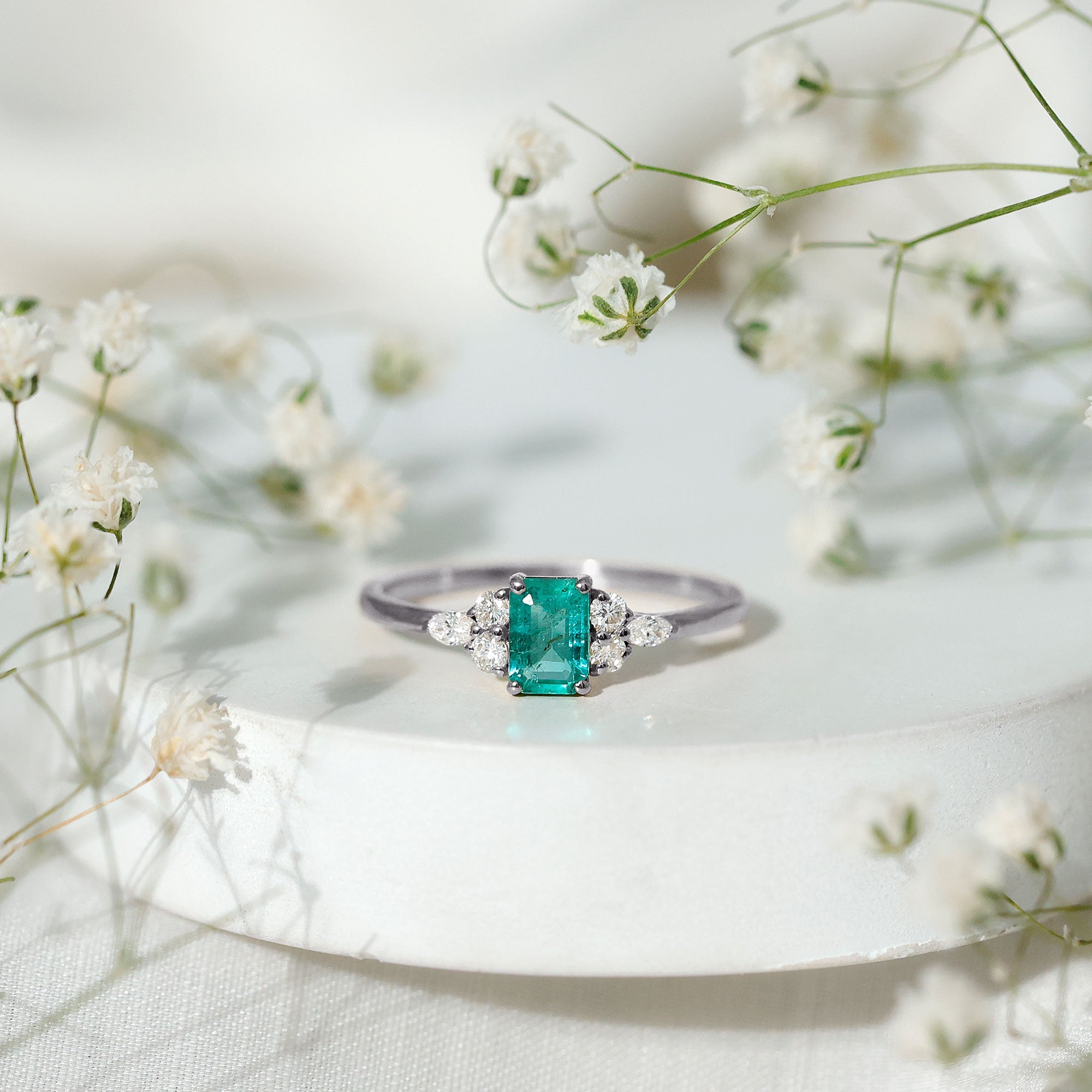 Emerald Engagement Ring | Unique Emerald Cut Ring with Diamond Trio & Balanced Gemstone Design