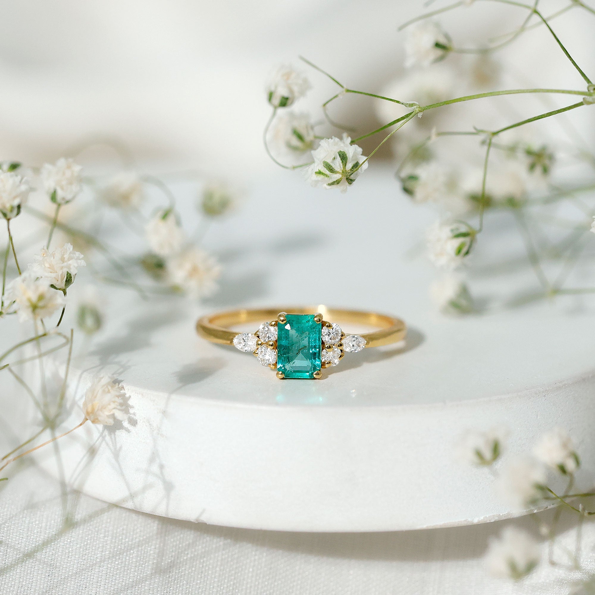 Emerald Engagement Ring | Unique Emerald Cut Ring with Diamond Trio & Balanced Gemstone Design