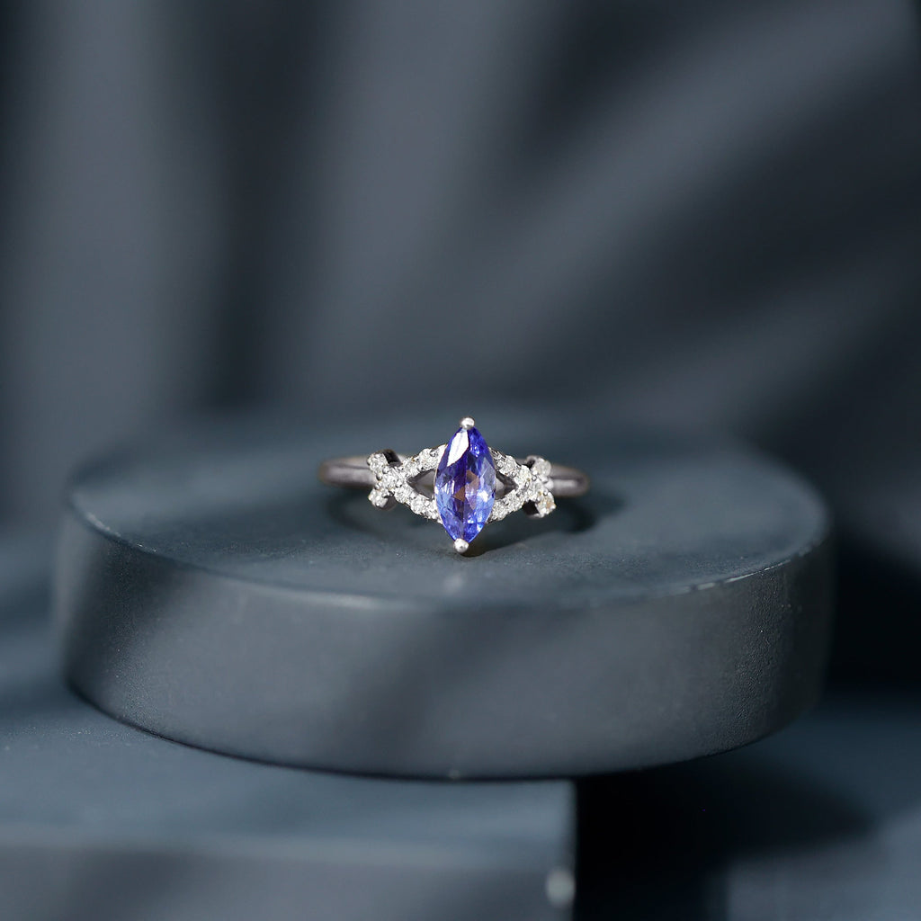 Marquise Tanzanite Ring – Elegant Blue Gemstone With Diamond Promise Band
