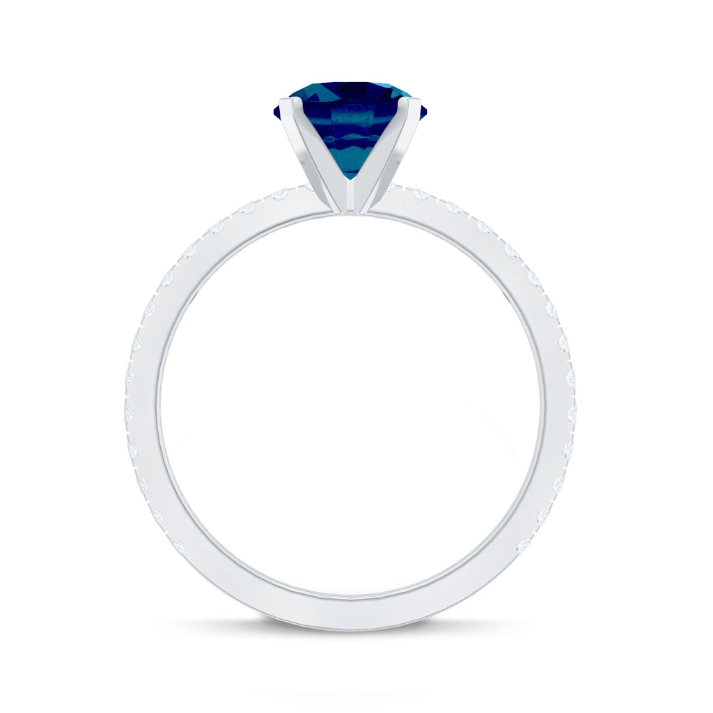 1.3 Carat Round London Blue Topaz Solitaire Ring with Diamond Side Stones