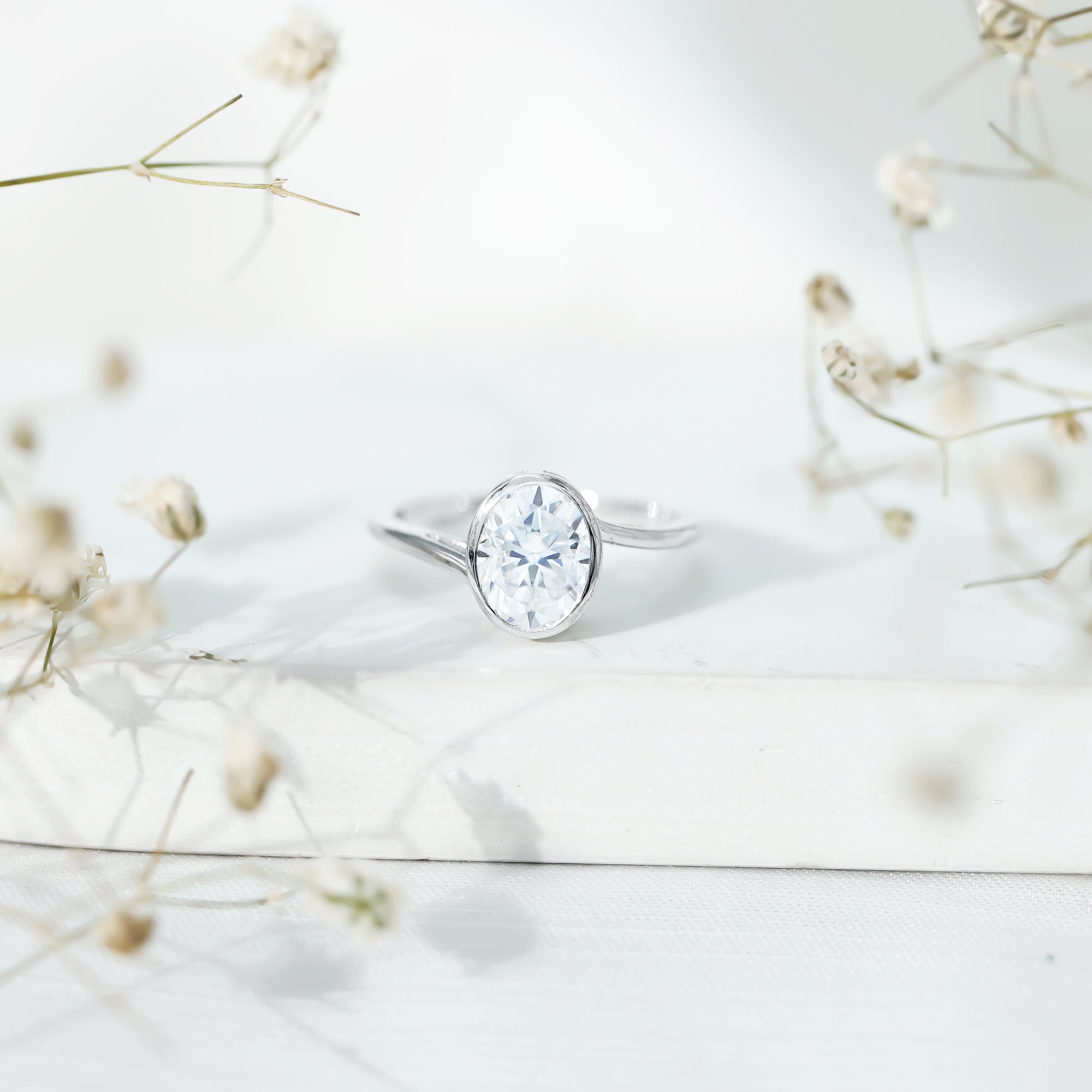 2 Carat Moissanite Ring - Oval Cut Bezel Set Solitaire with Bypass Shank