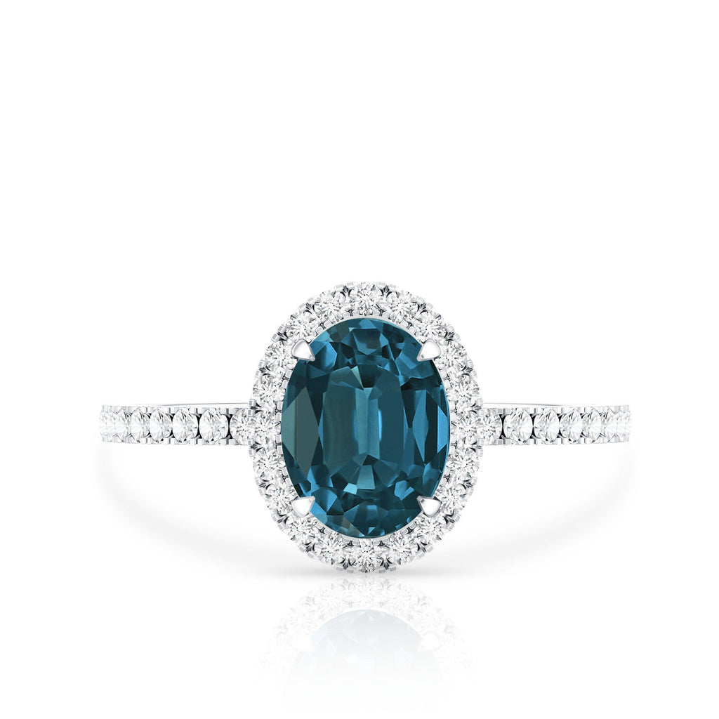 Oval 1 Carat London Blue Topaz Halo Engagement Ring