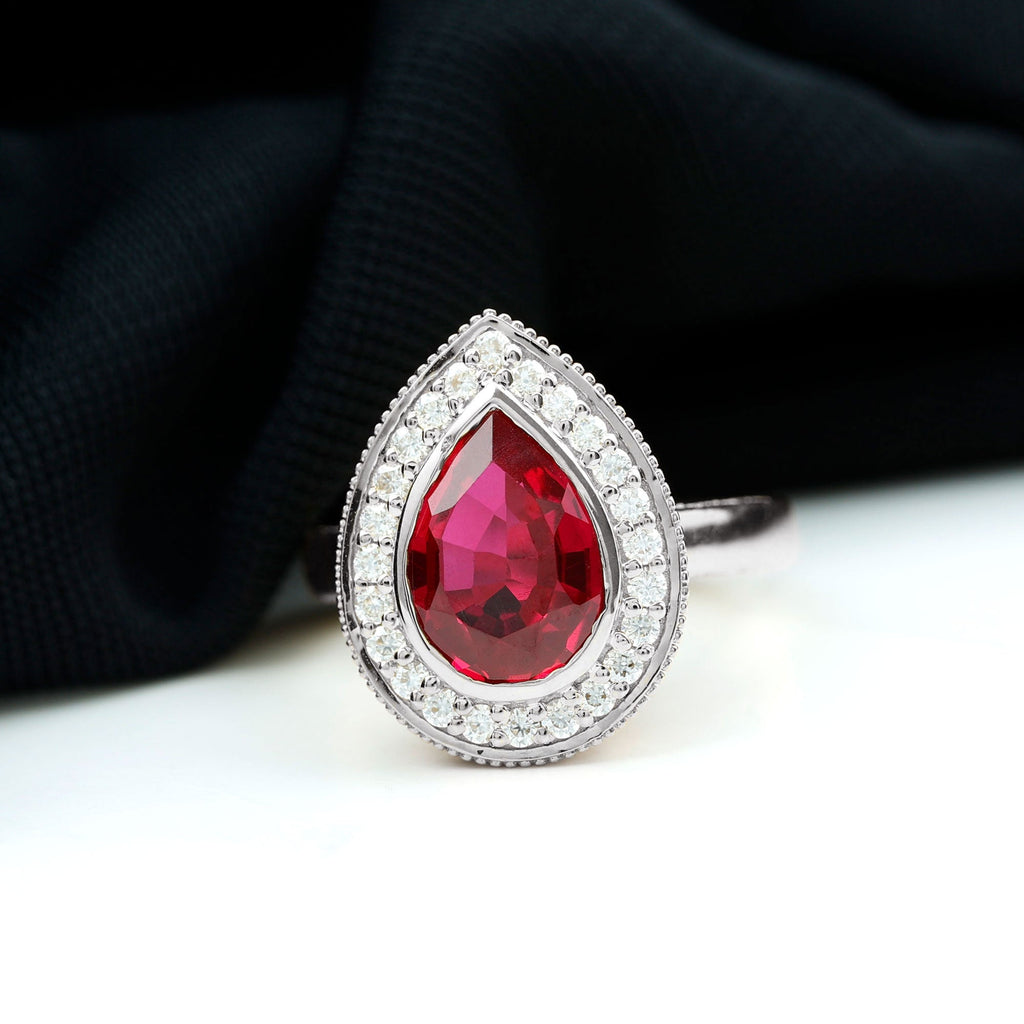 Lab Created Ruby Ring – 2.9 Ct Pear Shaped Ruby with Diamond Halo Design