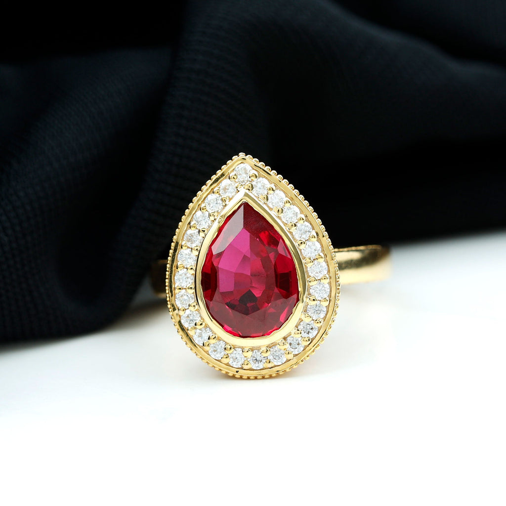 Lab Created Ruby Ring – 2.9 Ct Pear Shaped Ruby with Diamond Halo Design