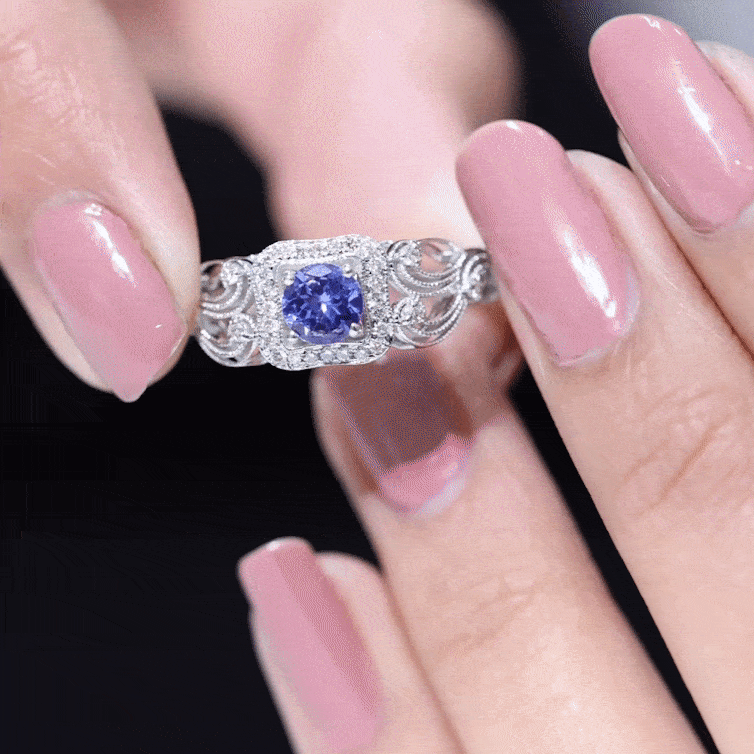 Vintage Tanzanite Ring – Prong Set 5mm Blue Gemstone with Diamond Halo Band