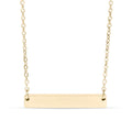 Gold bar necklace on a white background