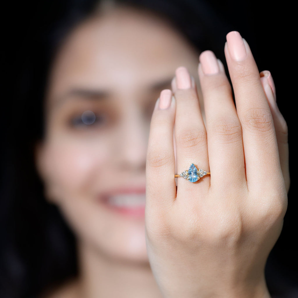 Aquamarine Engagement Ring – 1 Carat Pear Shaped Blue Gemstone With Diamond Trio