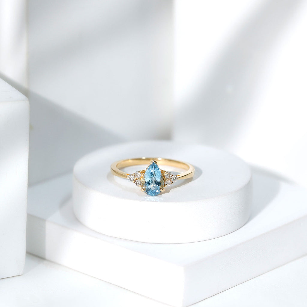 Aquamarine Engagement Ring – 1 Carat Pear Shaped Blue Gemstone With Diamond Trio