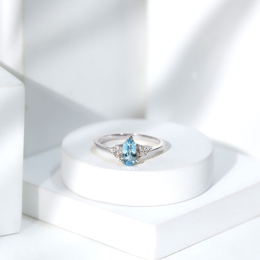 Aquamarine Engagement Ring – 1 Carat Pear Shaped Blue Gemstone With Diamond Trio