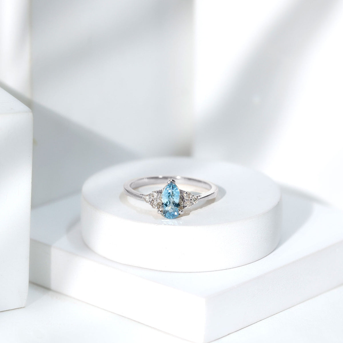 Aquamarine Engagement Ring – 1 Carat Pear Shaped Blue Gemstone With Diamond Trio