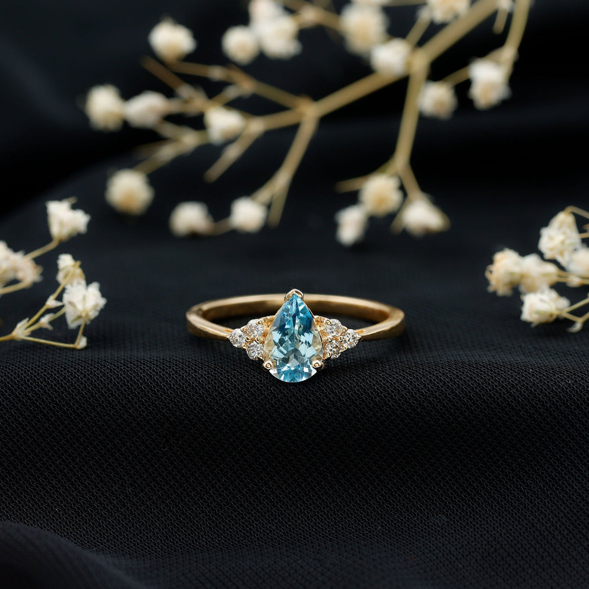 Aquamarine Engagement Ring – 1 Carat Pear Shaped Blue Gemstone With Diamond Trio