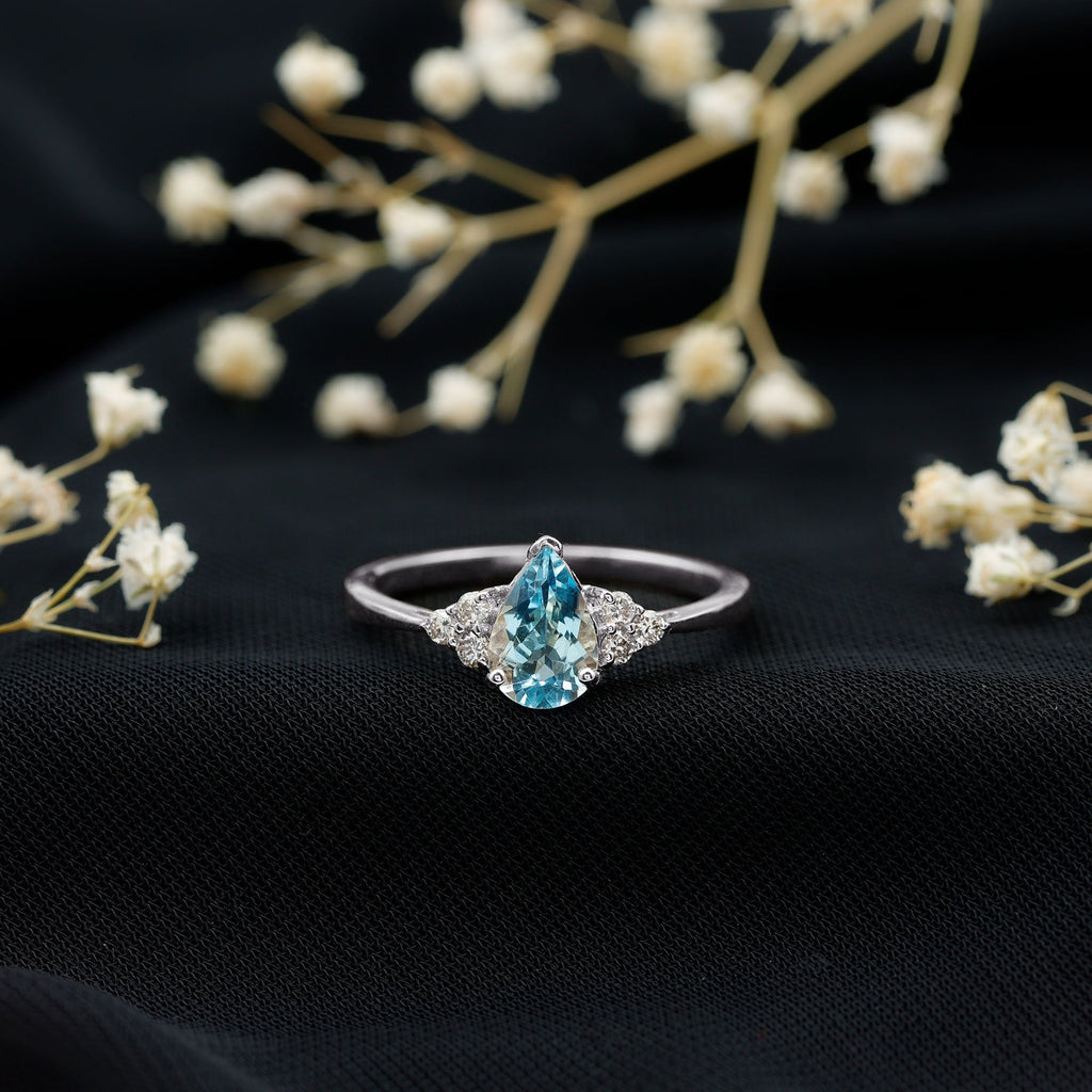 Aquamarine Engagement Ring – 1 Carat Pear Shaped Blue Gemstone With Diamond Trio