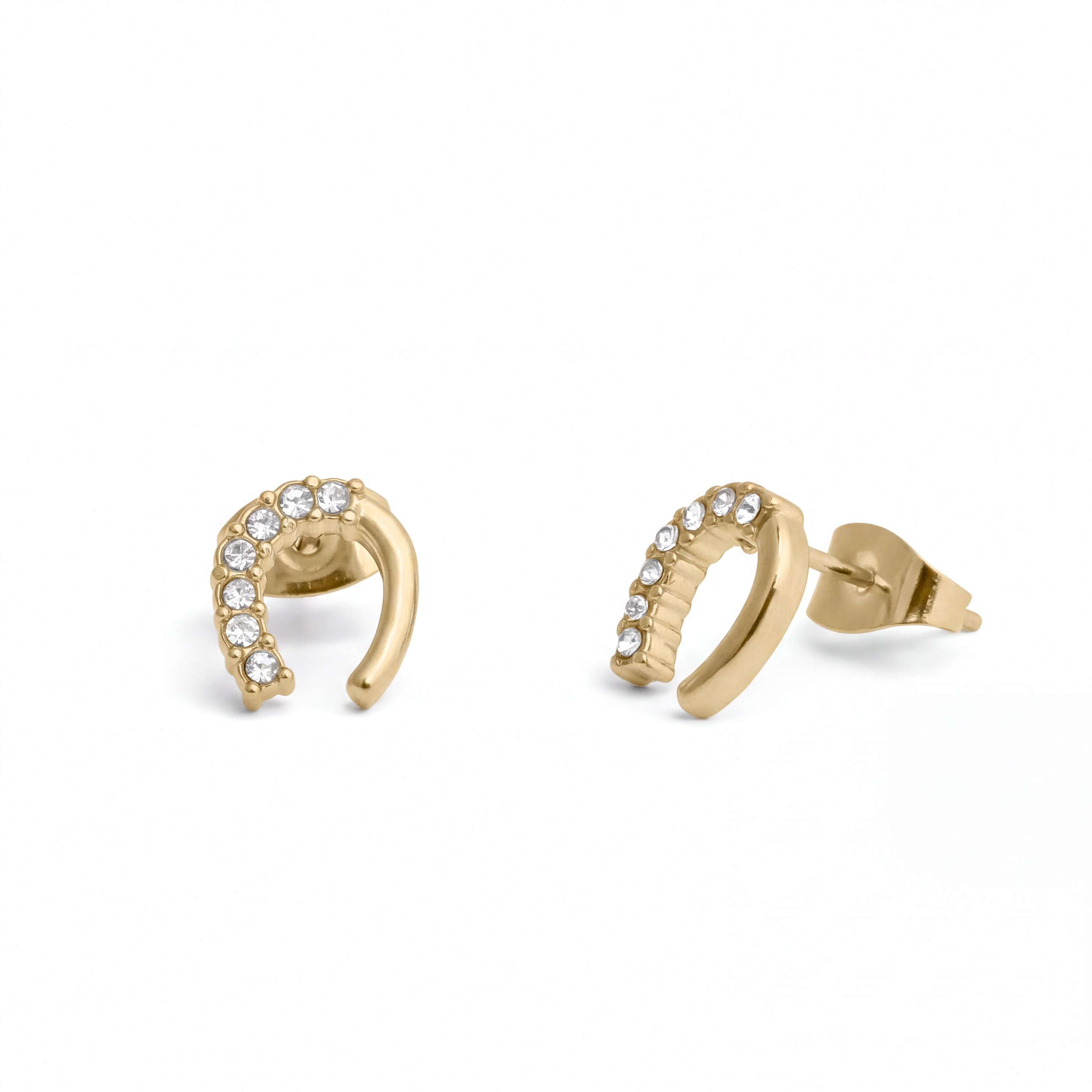 a pair of gold-colored earrings with small diamonds on them.