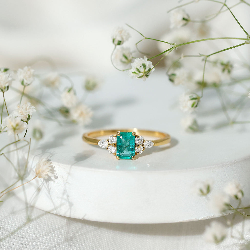 Emerald Cut Engagement Ring – Diamond Trio Setting with AAA Quality Emerald Stone
