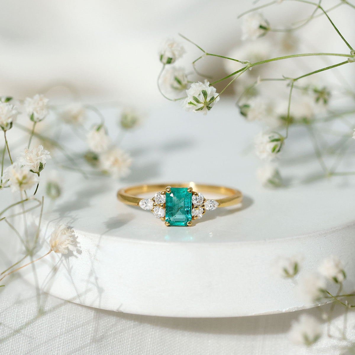 Emerald Cut Engagement Ring – Diamond Trio Setting with AAA Quality Emerald Stone