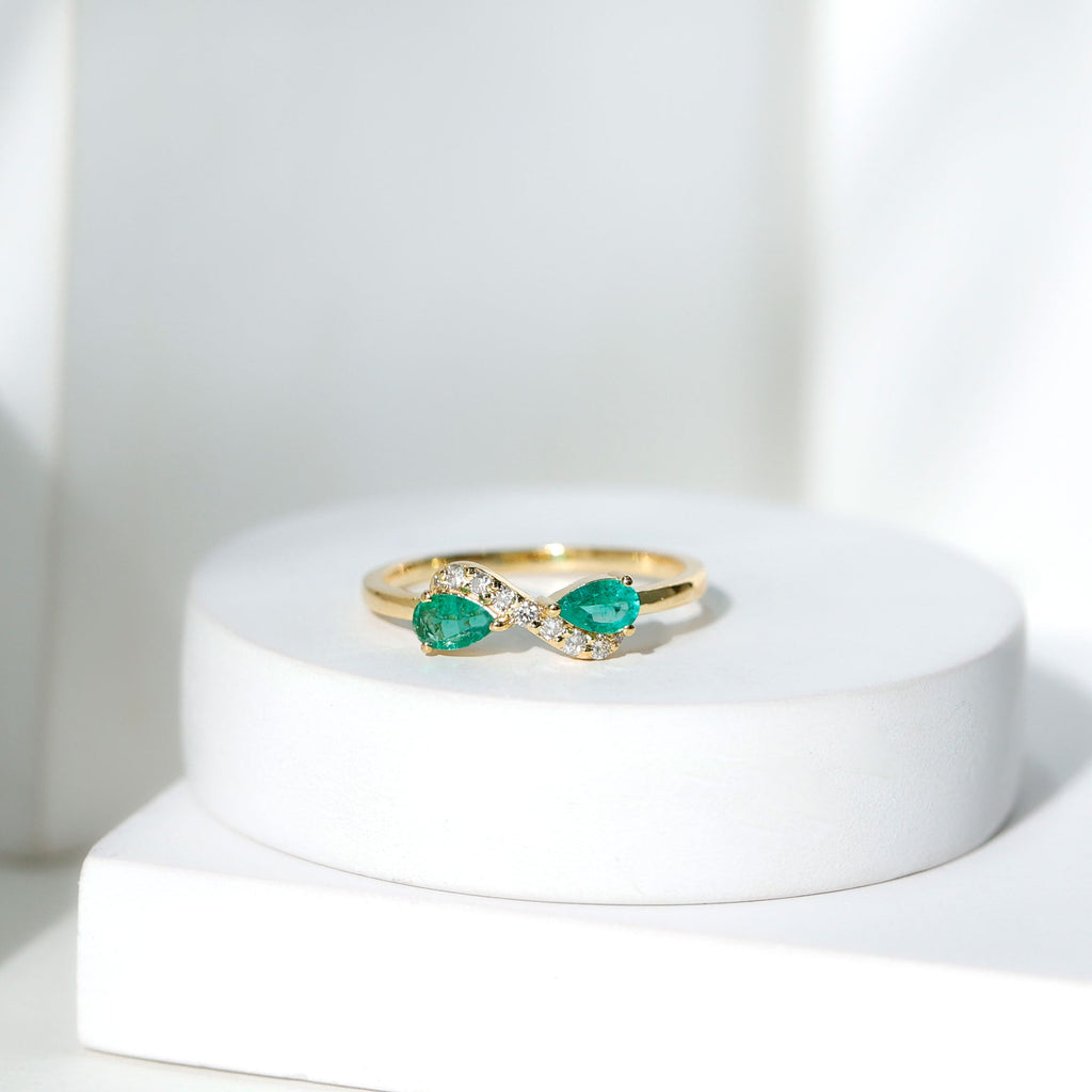 Emerald Diamond Promise Ring – Two Stone Infinity Pear Shaped Emerald Ring