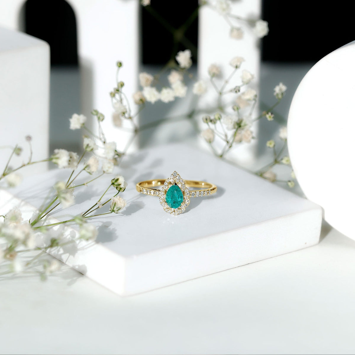 Emerald Engagement Ring – Pear Shaped Ring with Diamond Halo and Leaf Pattern