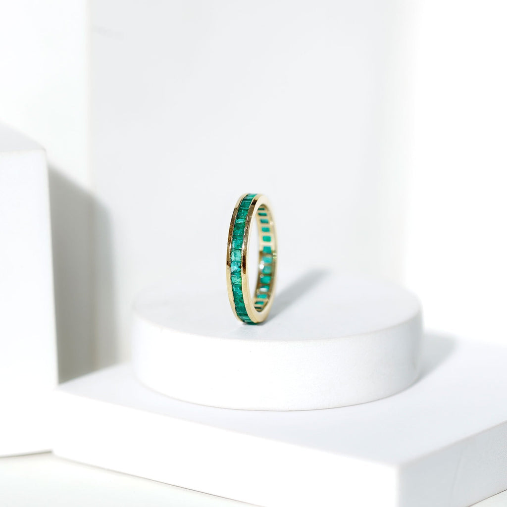Emerald Eternity Band – Princess Cut Channel Set Ring With Structured Design