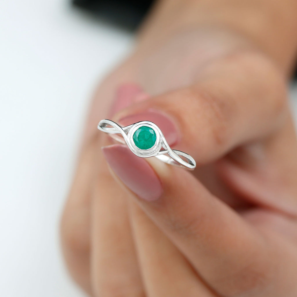 Emerald Solitaire Ring – Round Cut Emerald with Modern Crossover Band Design