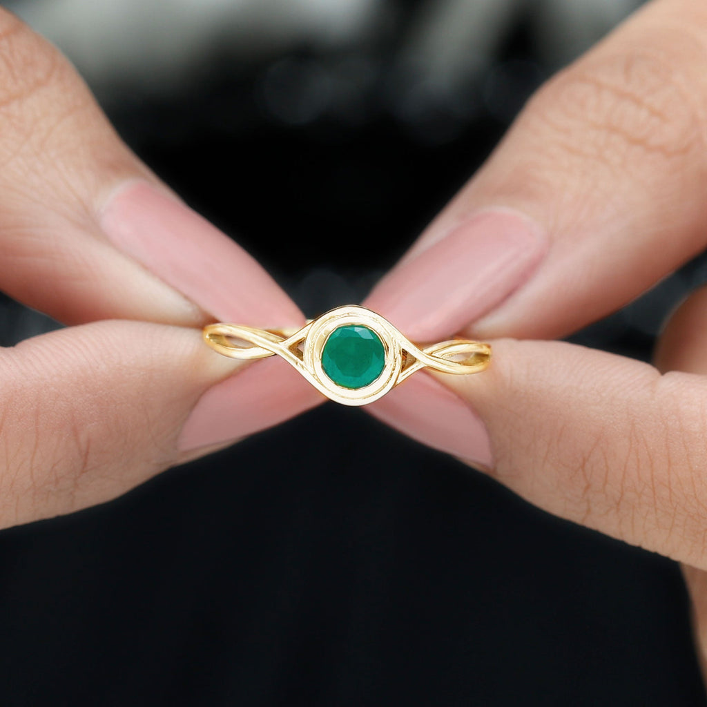 Emerald Solitaire Ring – Round Cut Emerald with Modern Crossover Band Design
