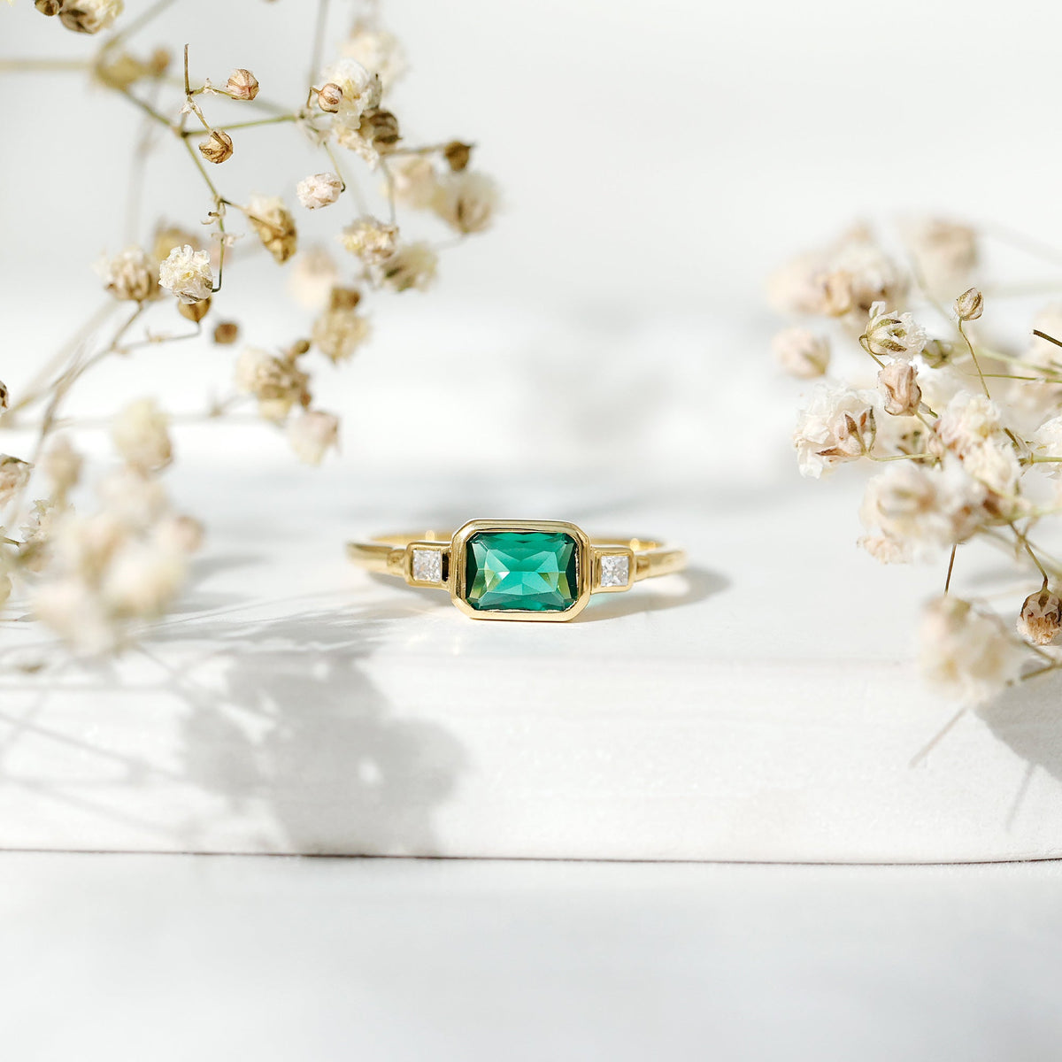 Lab Grown Emerald Ring - East West Emerald Cut Three Stone Bezel Set in 14K Gold