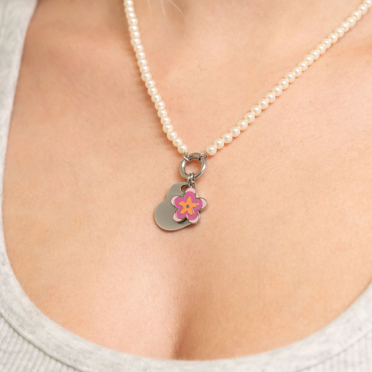Polished Heart Pendant with flower charm on pearl necklace