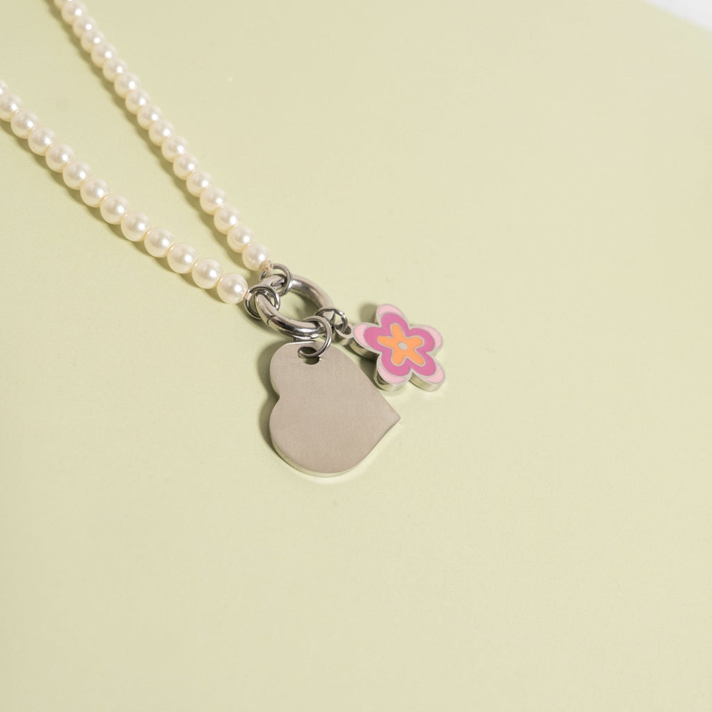 Polished Heart Pendant with flower charm on pearl necklace